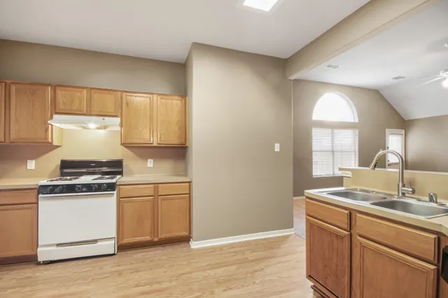 a kitchen with a stove and a sink
