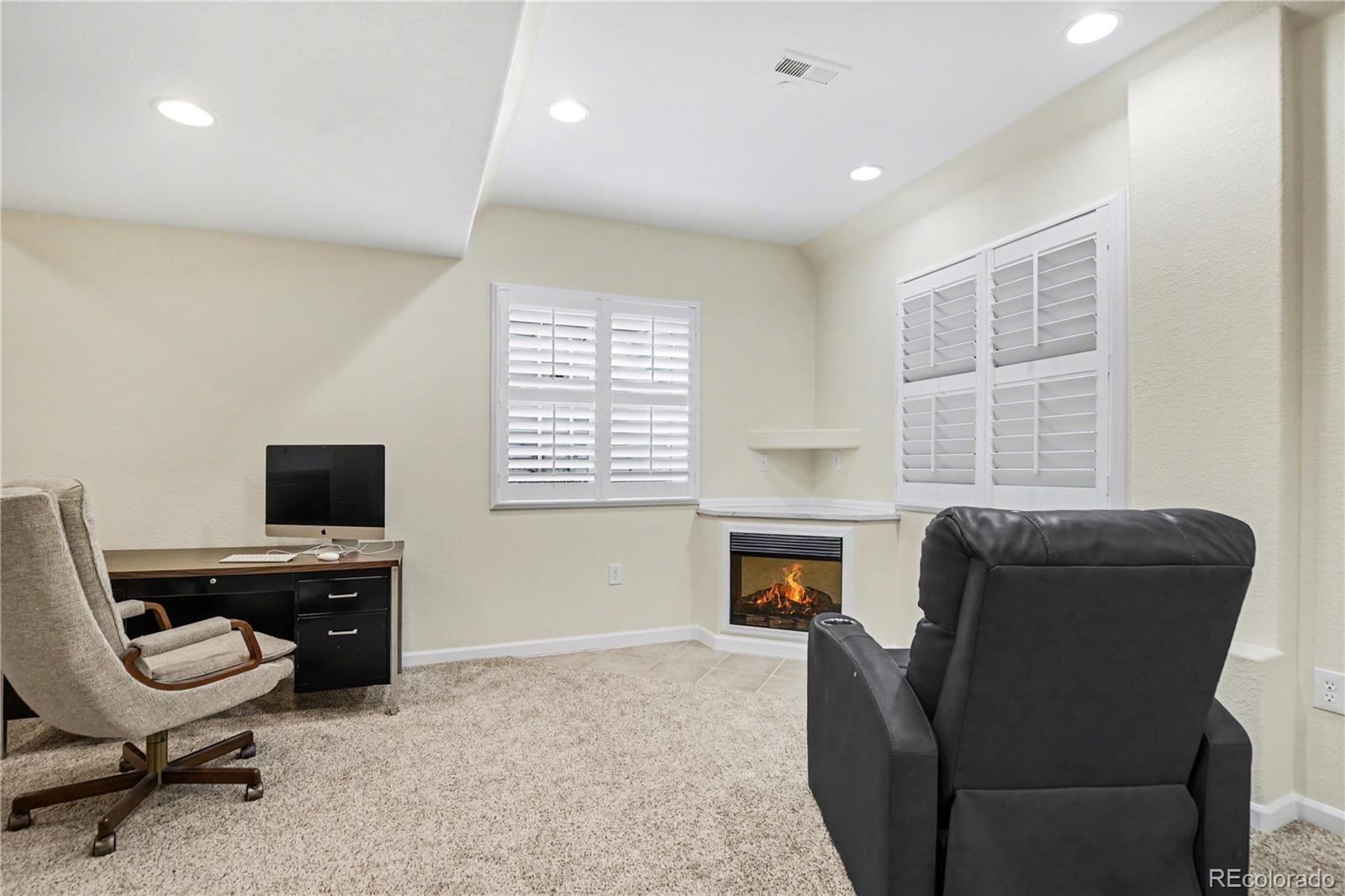 10871 Chambers Way Commerce City, CO 80022 - Photo 31 of 50 a view of a livingroom with workspace and a window
