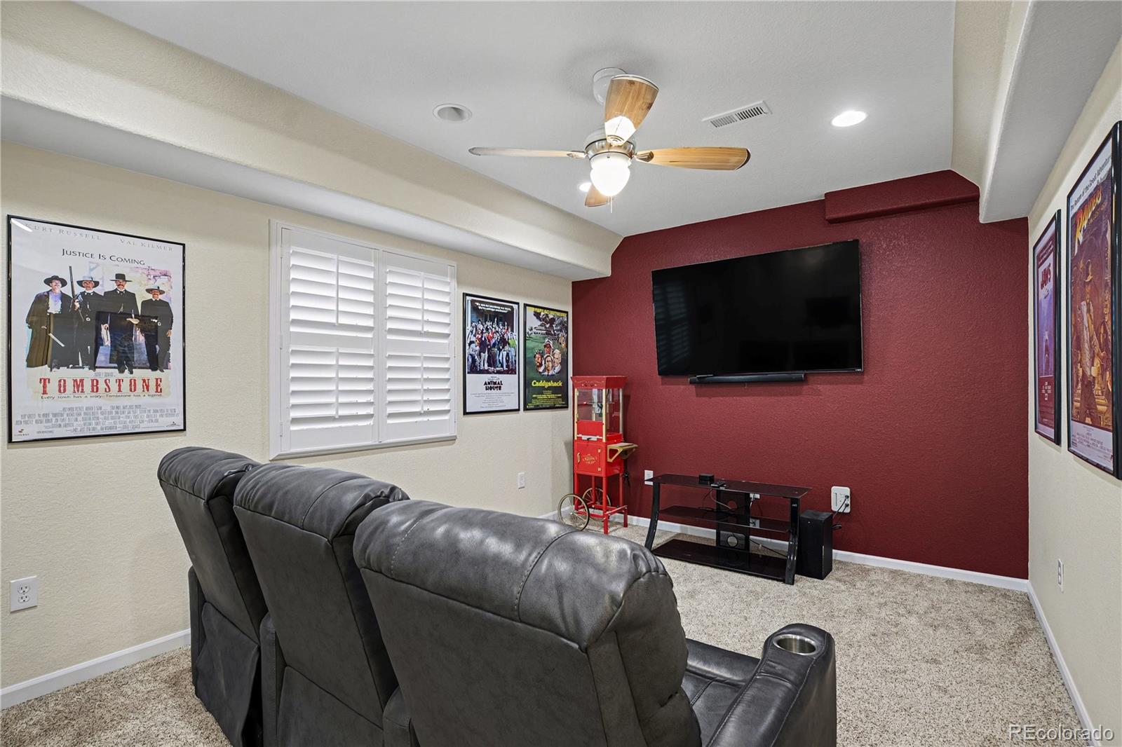 10871 Chambers Way Commerce City, CO 80022 - Photo 33 of 50 a living room with furniture and a flat screen tv