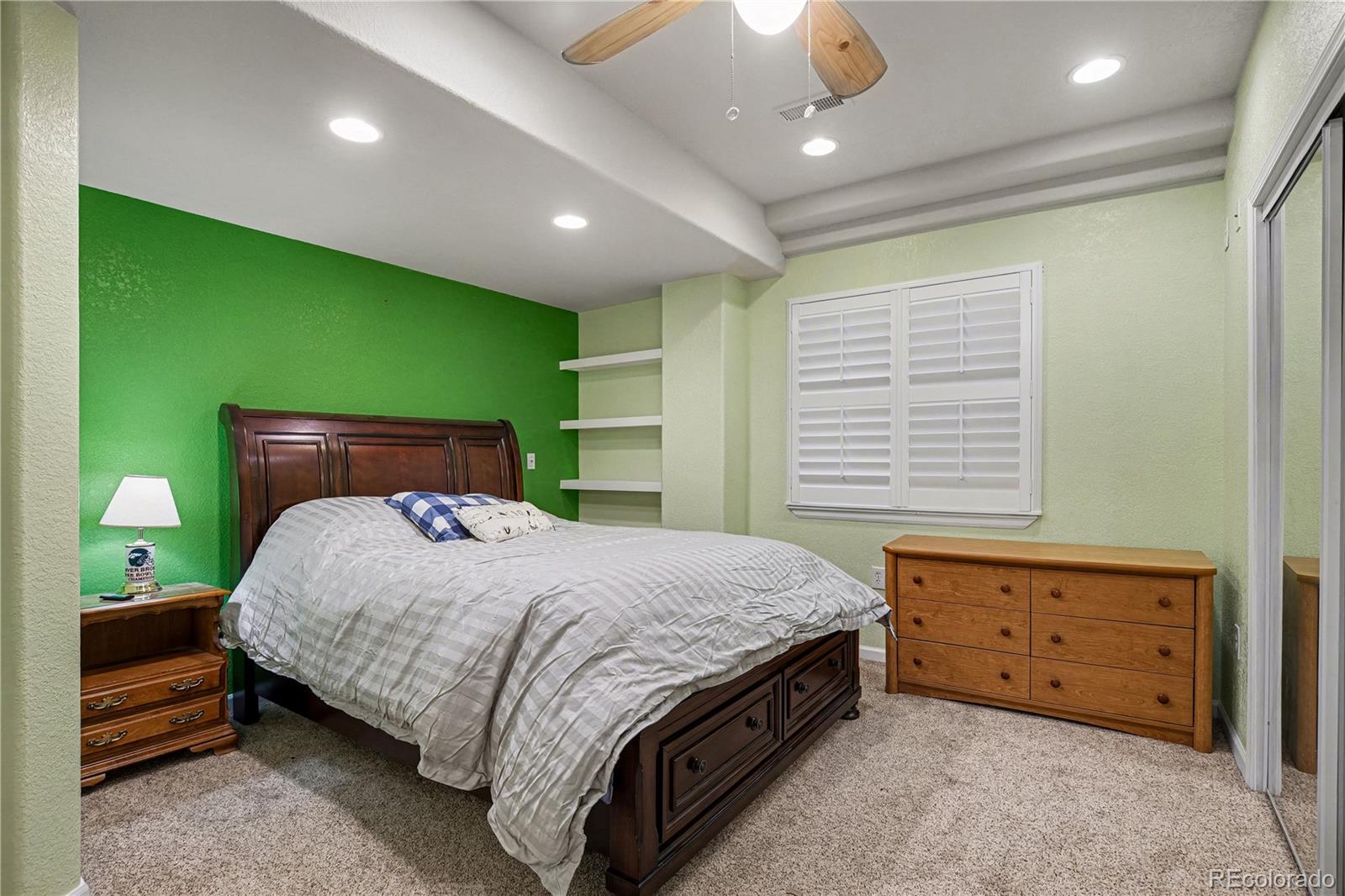10871 Chambers Way Commerce City, CO 80022 - Photo 35 of 50 a bedroom with a bed and a window