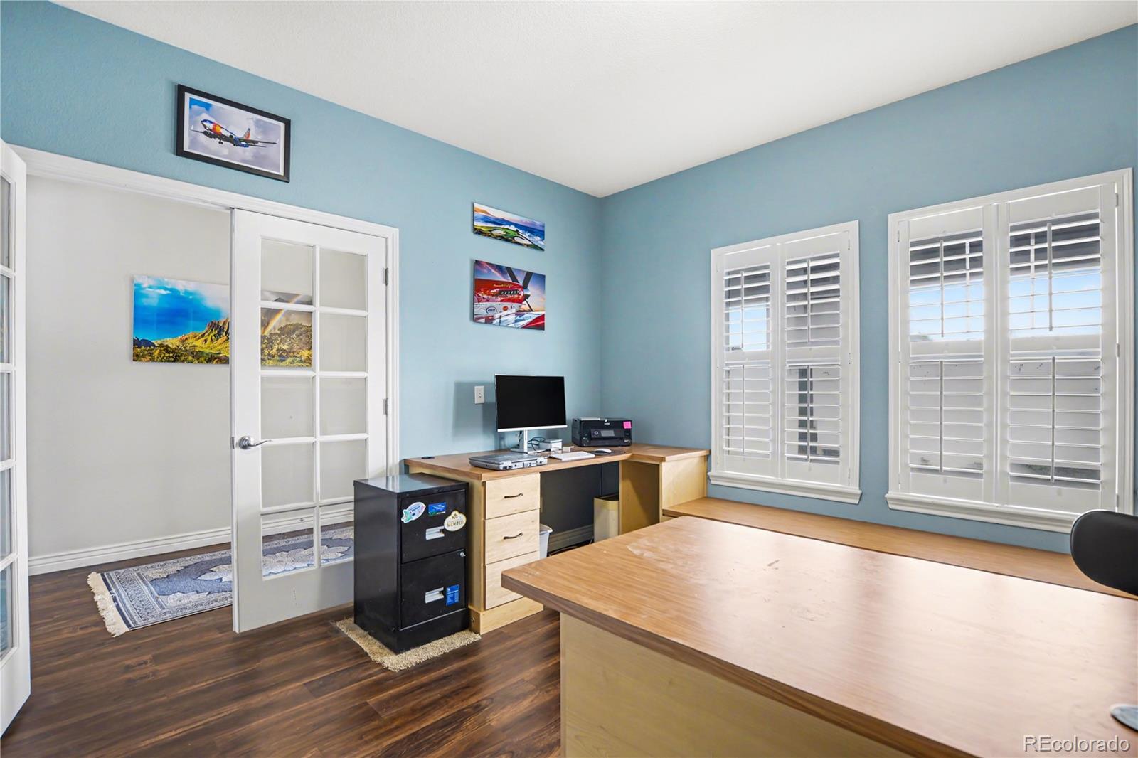 10871 Chambers Way Commerce City, CO 80022 - Photo 4 of 50 a view of a workspace with furniture and a window