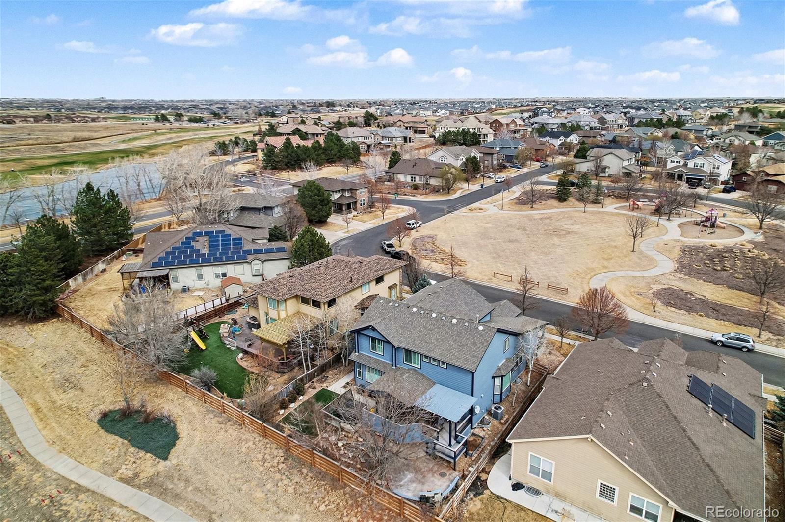 10871 Chambers Way Commerce City, CO 80022 - Photo 47 of 50 an aerial view of a city with lots of residential buildings and ocean view in back
