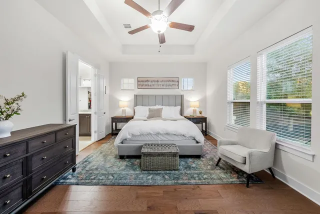 a large kitchen with a table and chairs