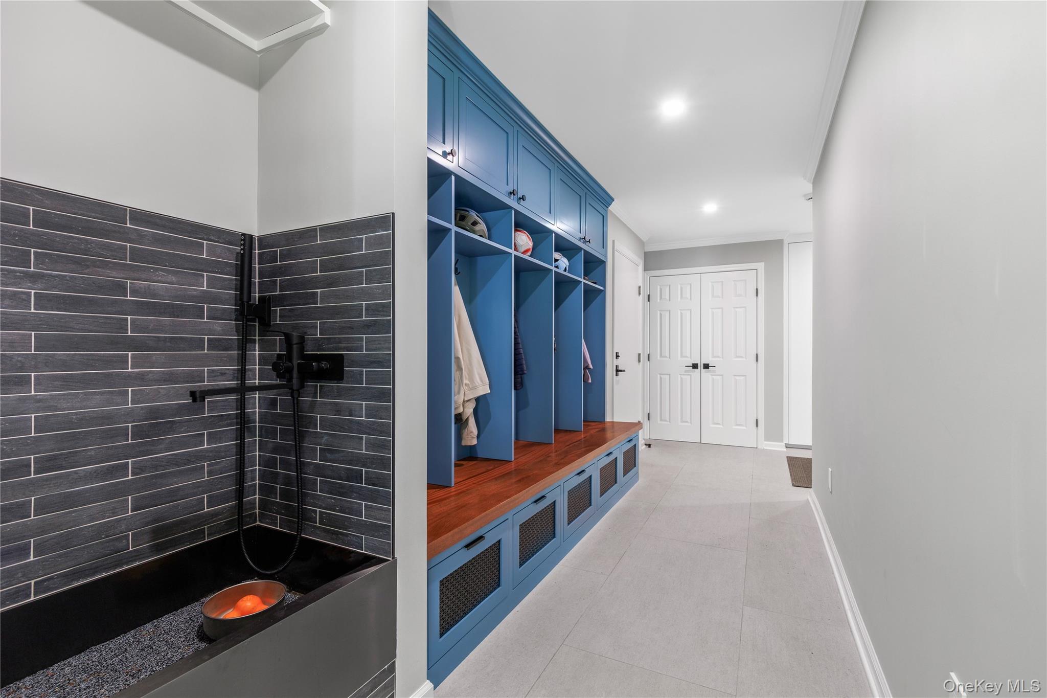 19 John Jay Place Rye, NY 10580 - Photo 24 of 45 There is a cubbyhole for everyone, a shared double coat closet, and even a stylish dog wash station.