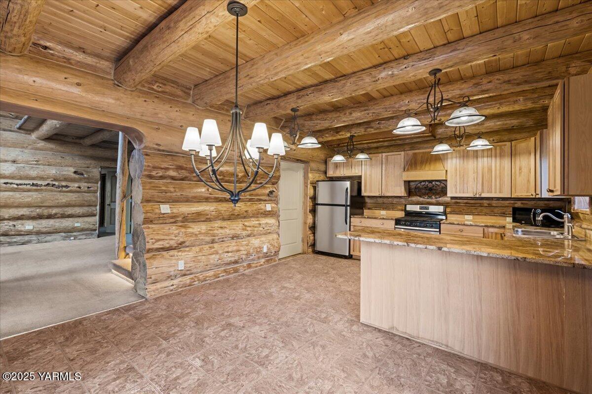 4492 Nile Road Naches, WA 98937 - Photo 11 of 38 a view of a kitchen with refrigerator and a sink
