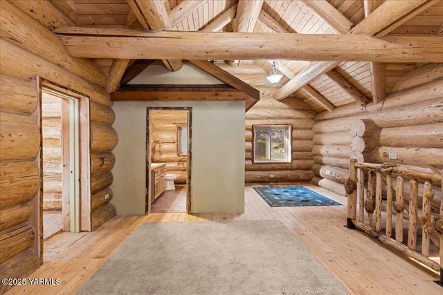 a bathroom with a granite countertop sink a mirror and shower