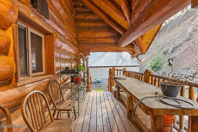 a view of outdoor space with deck and tree