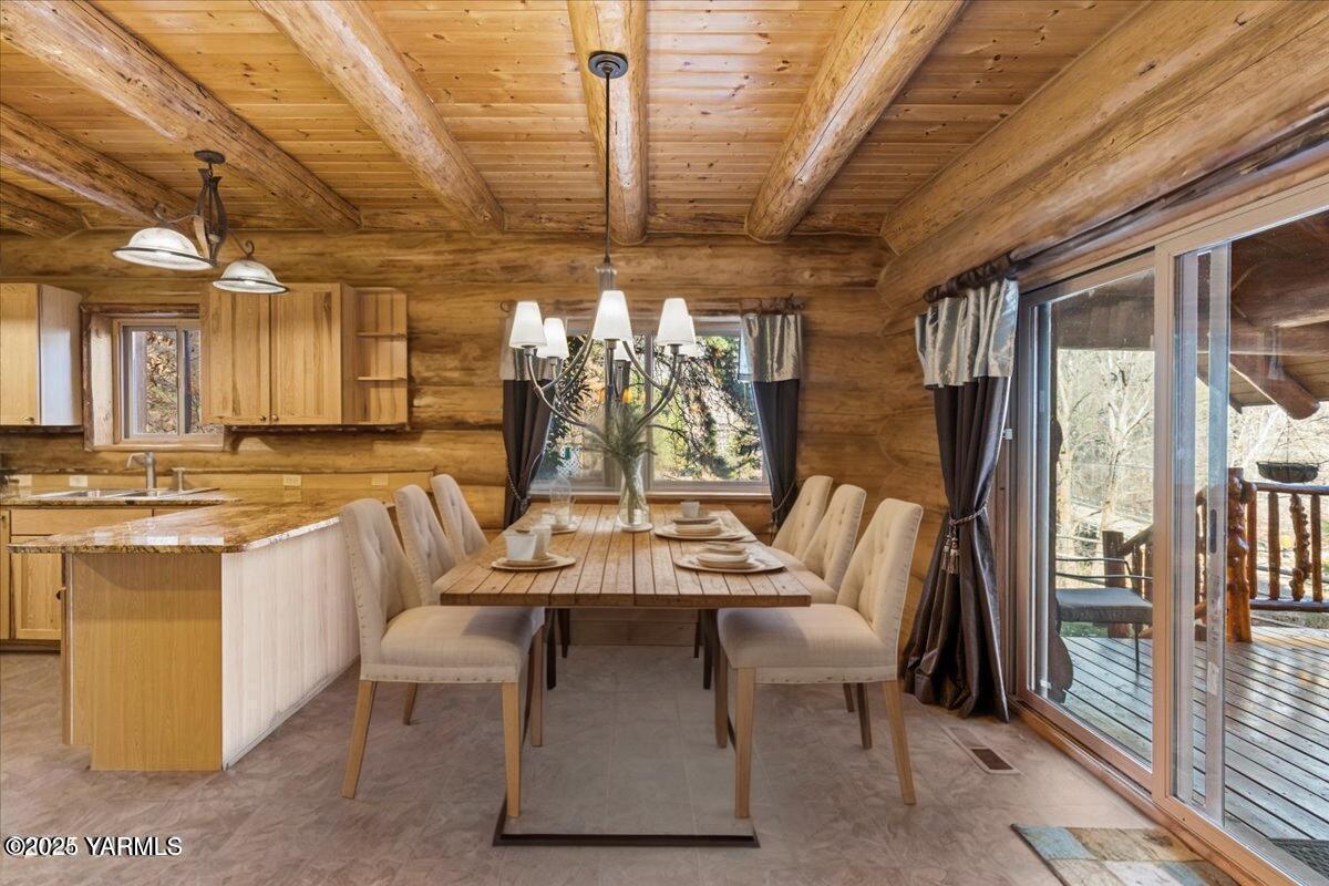 4492 Nile Road Naches, WA 98937 - Photo 8 of 38 a dining hall with stainless steel appliances kitchen island granite countertop a dining table and chairs