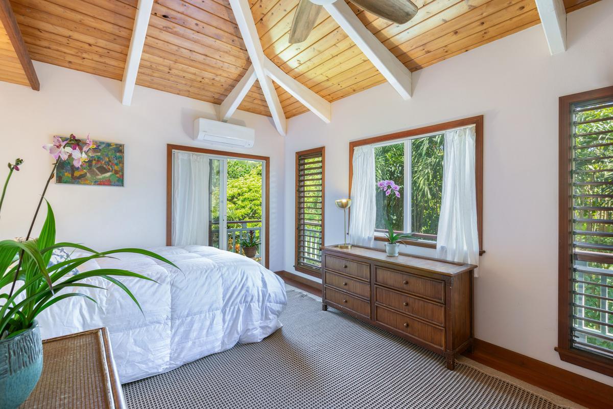 24 Off Moloaa Road Kilauea, HI 96754 - Photo 12 of 25 a bedroom with a bed and a potted plant