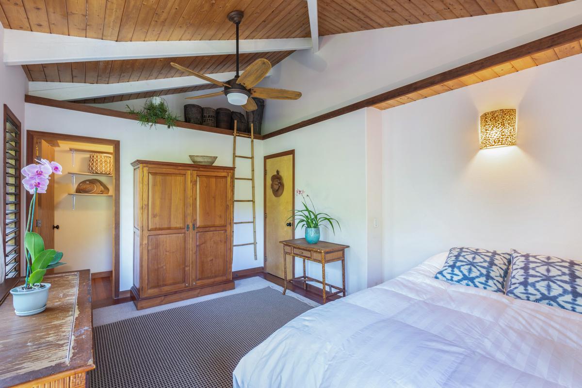 24 Off Moloaa Road Kilauea, HI 96754 - Photo 14 of 25 a bedroom with a bed and ceiling fan