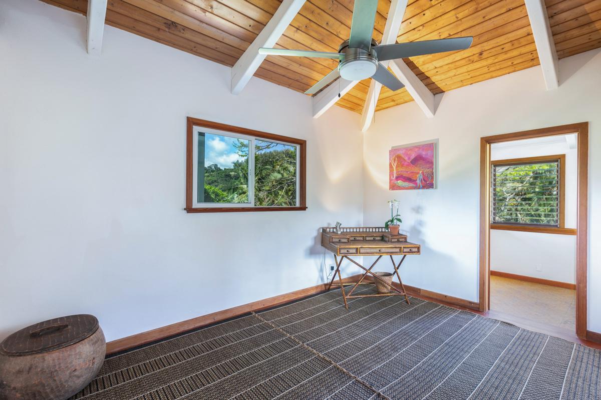 24 Off Moloaa Road Kilauea, HI 96754 - Photo 17 of 25 a room with wooden floor and a window
