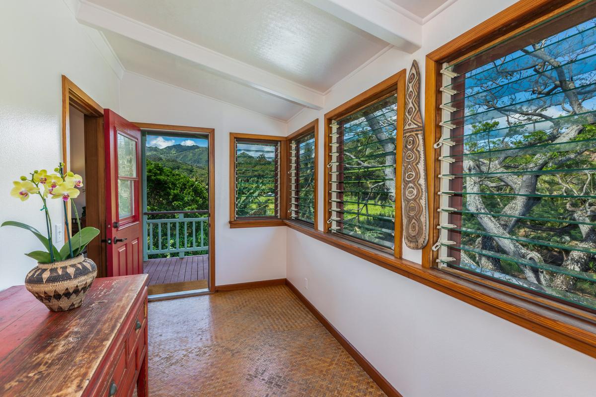 24 Off Moloaa Road Kilauea, HI 96754 - Photo 19 of 25 a living room filled with furniture and a potted plant