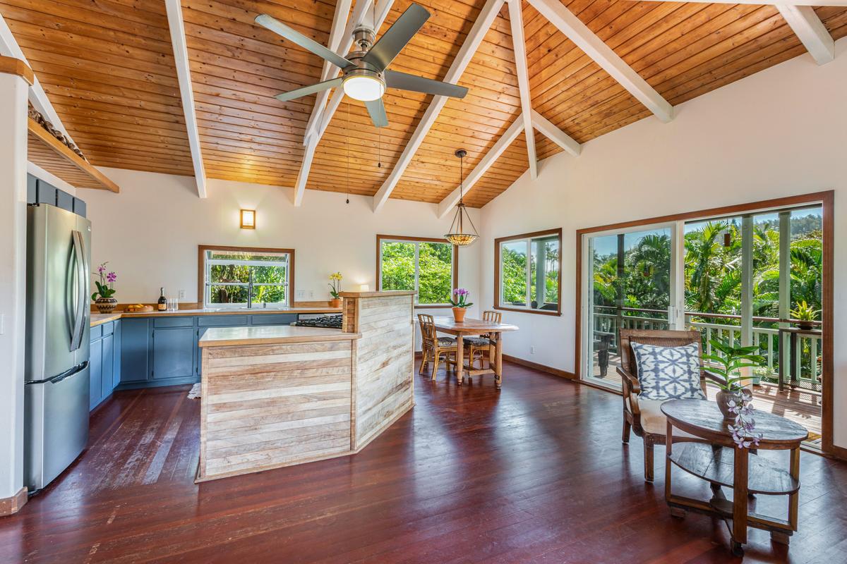 24 Off Moloaa Road Kilauea, HI 96754 - Photo 6 of 25 a view of a dining room with furniture window and wooden floor