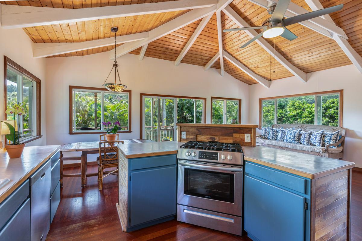 24 Off Moloaa Road Kilauea, HI 96754 - Photo 8 of 25 a kitchen with a stove a microwave and windows