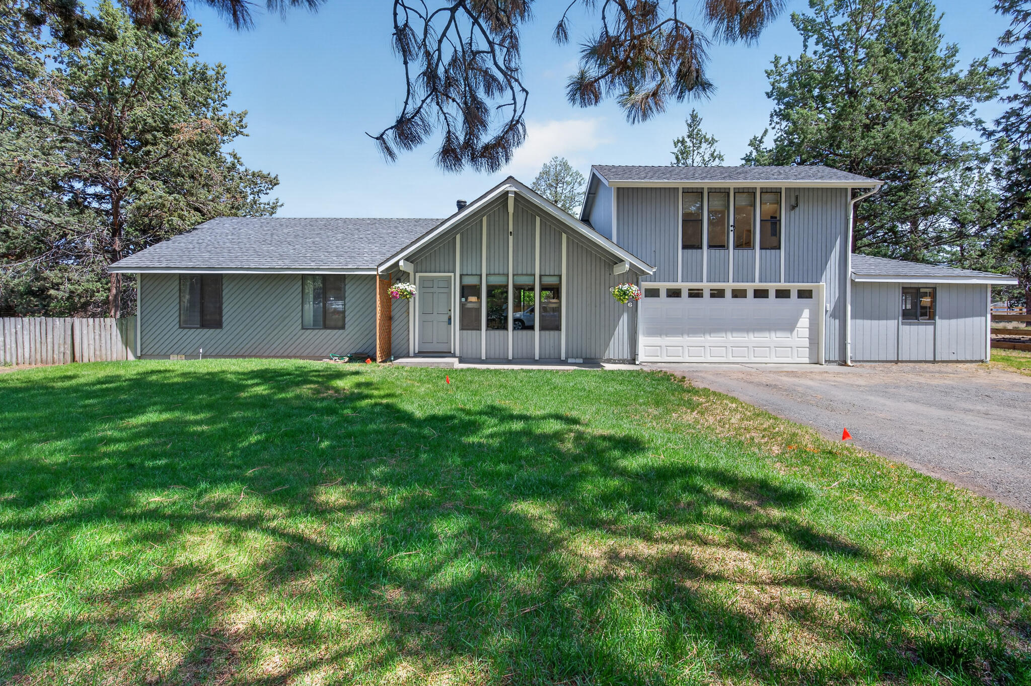 60866 Brosterhous Road Bend, OR 97702 - Photo 1 of 41 a front view of house with yard and green space