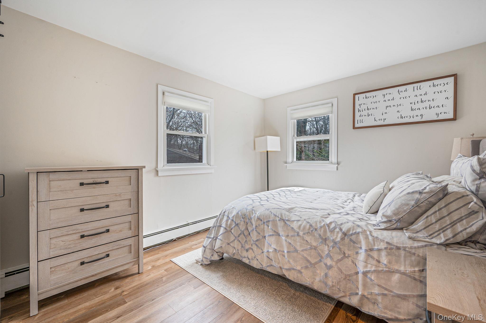 5 Valley Circle Miller Place, NY 11764 - Photo 19 of 38 a bedroom with a bed and a window