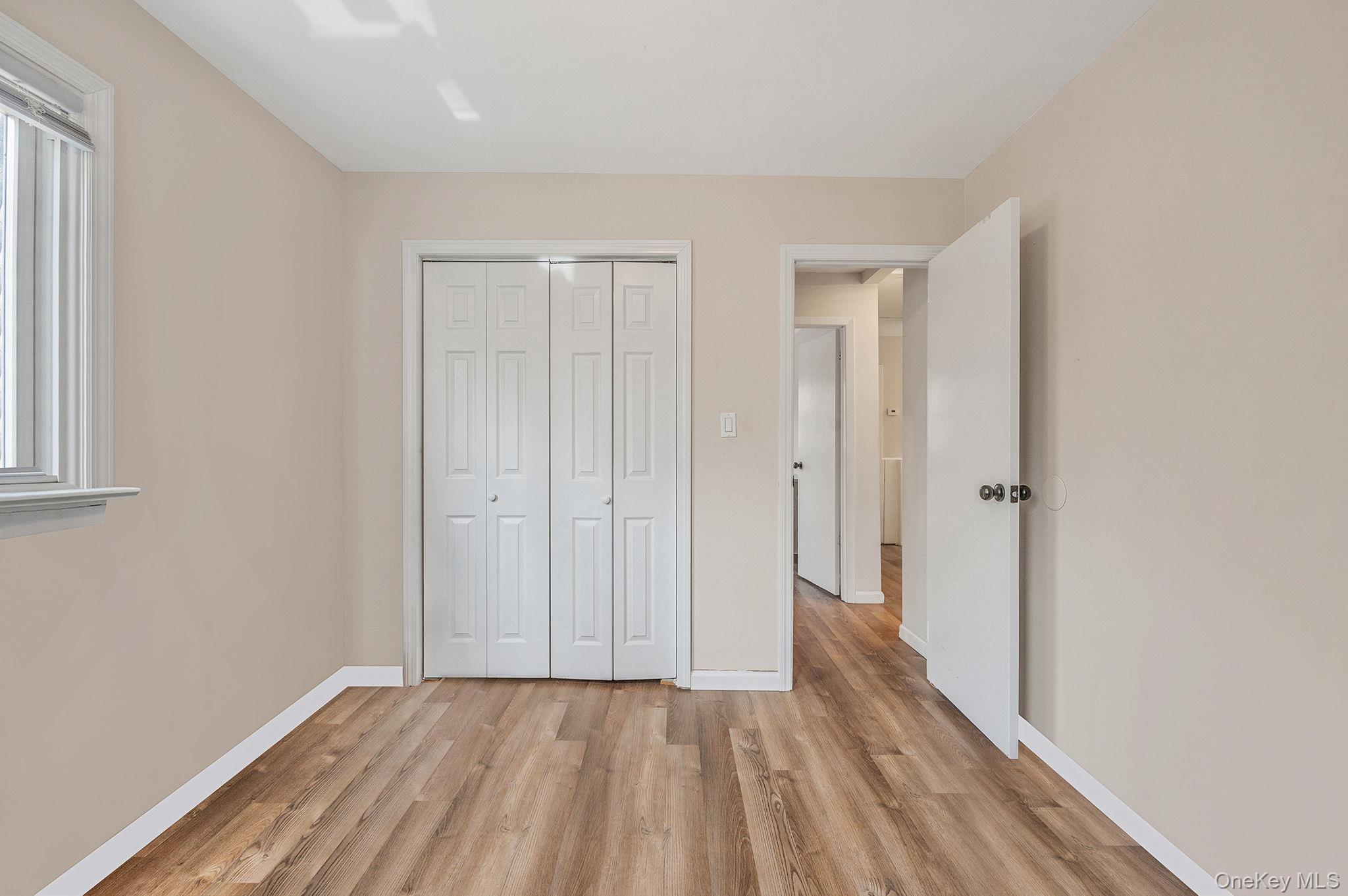 5 Valley Circle Miller Place, NY 11764 - Photo 22 of 38 a view of a livingroom with wooden floor