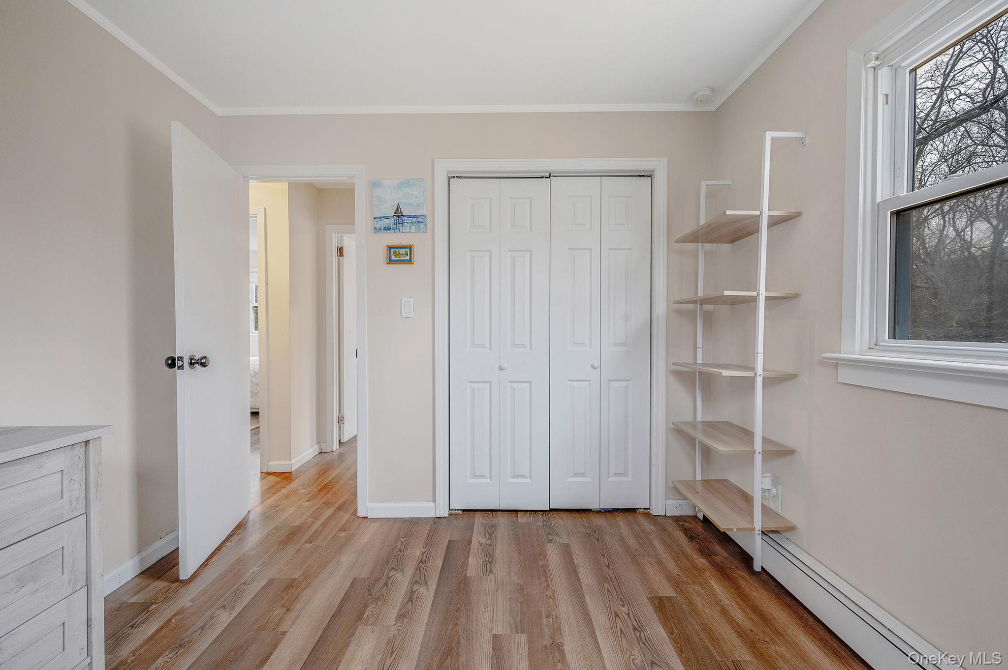 5 Valley Circle Miller Place, NY 11764 - Photo 24 of 38 a view of a room with wooden floor and closet