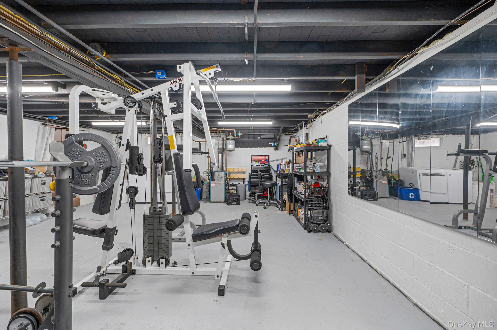 5 Valley Circle Miller Place, NY 11764 - Photo 26 of 38 a view of a room with gym equipment