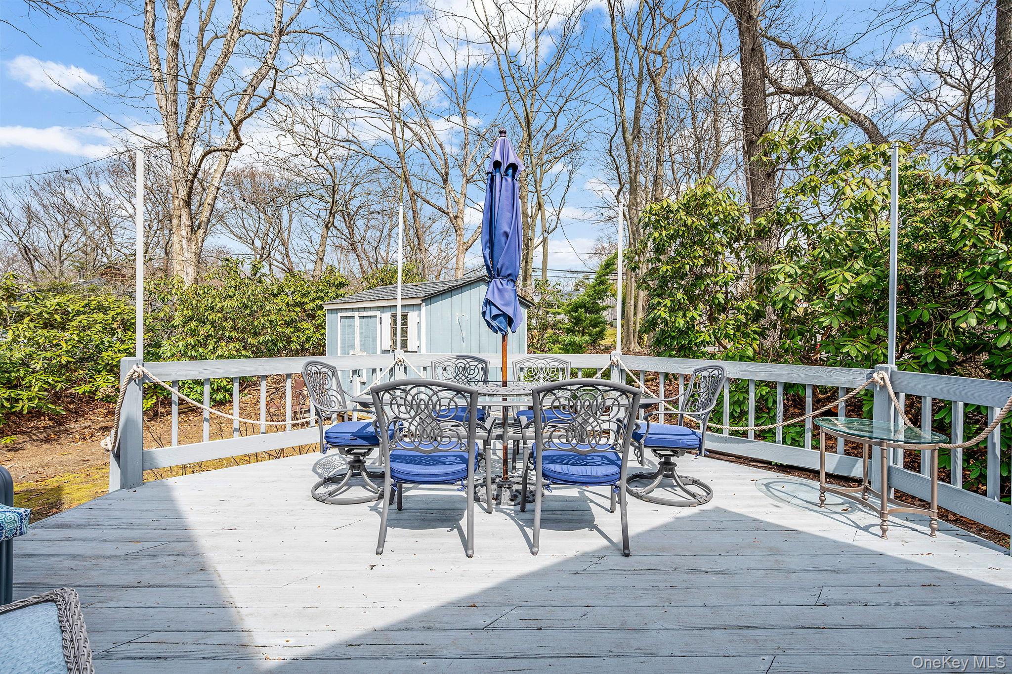5 Valley Circle Miller Place, NY 11764 - Photo 29 of 38 a view of a chairs and table on the wooden floor