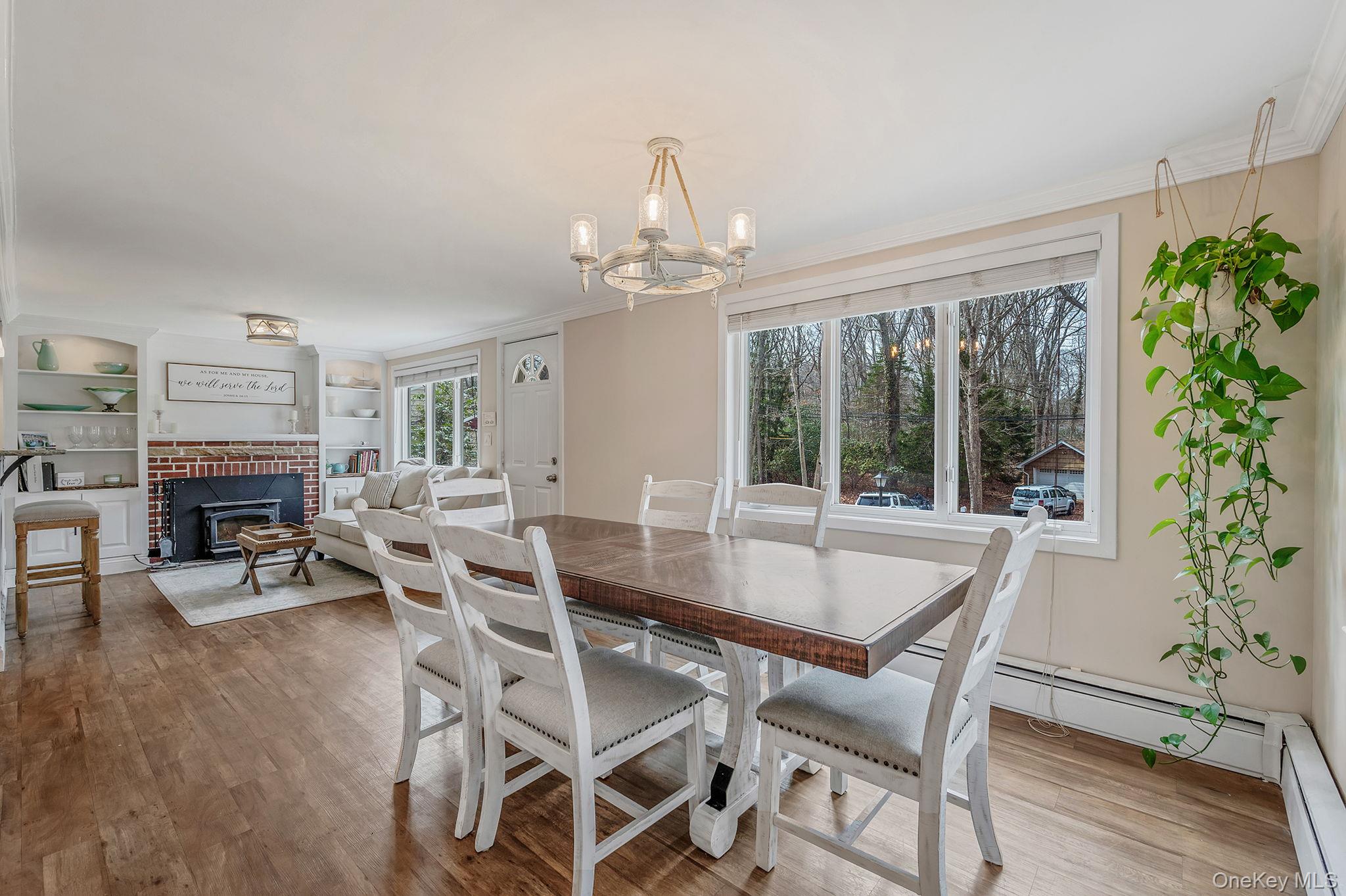 5 Valley Circle Miller Place, NY 11764 - Photo 9 of 38 a view of a dining room with furniture window and outside view