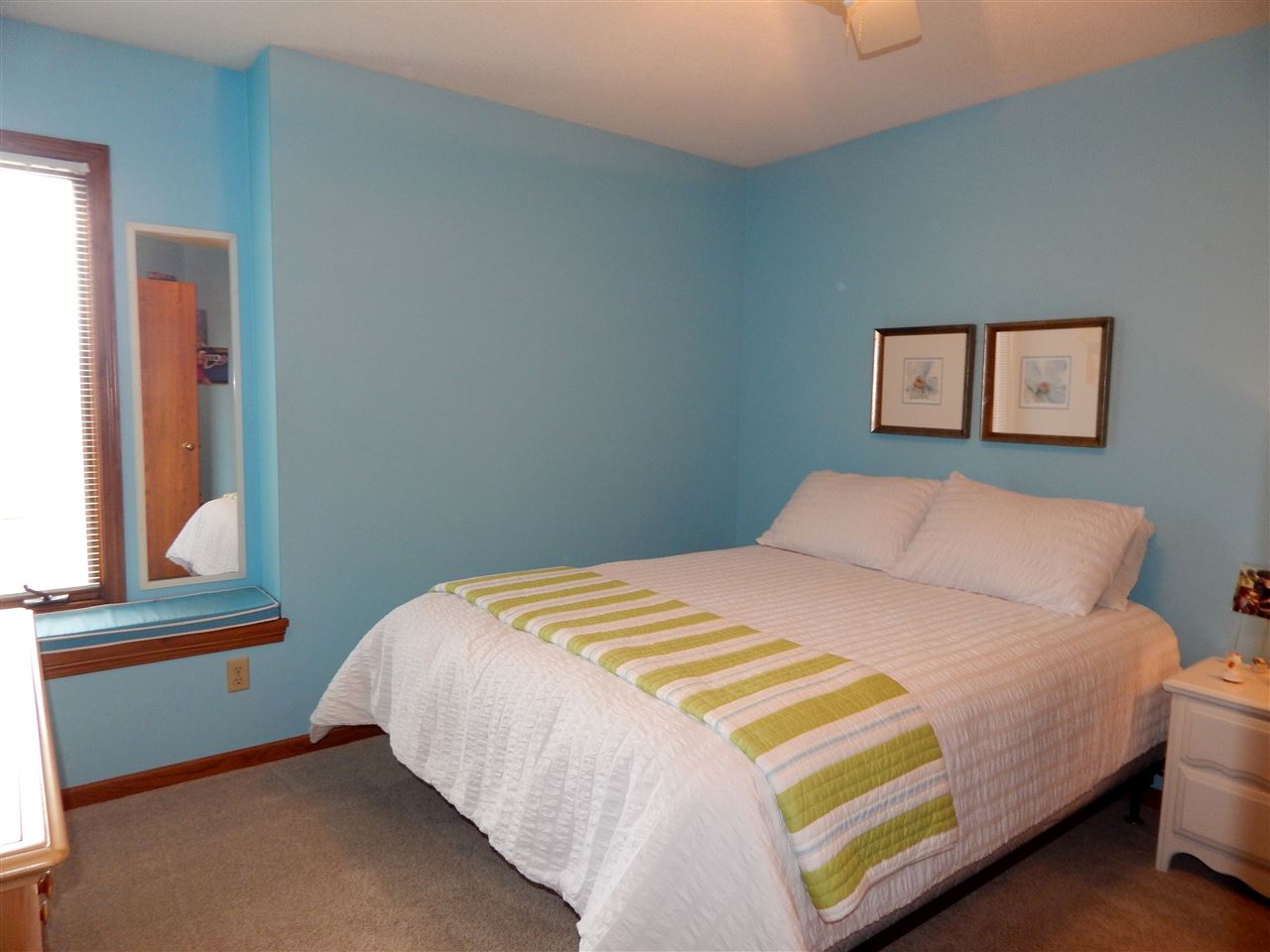 10001 Atwood Road Roscoe, IL 61073 - Photo 18 of 24 a bedroom with a bed and window
