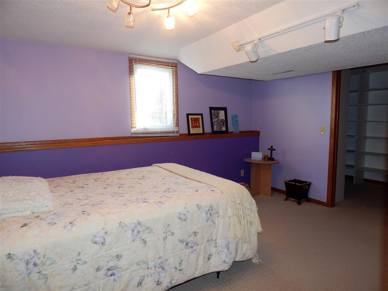 10001 Atwood Road Roscoe, IL 61073 - Photo 20 of 24 a bedroom with a bed and a window