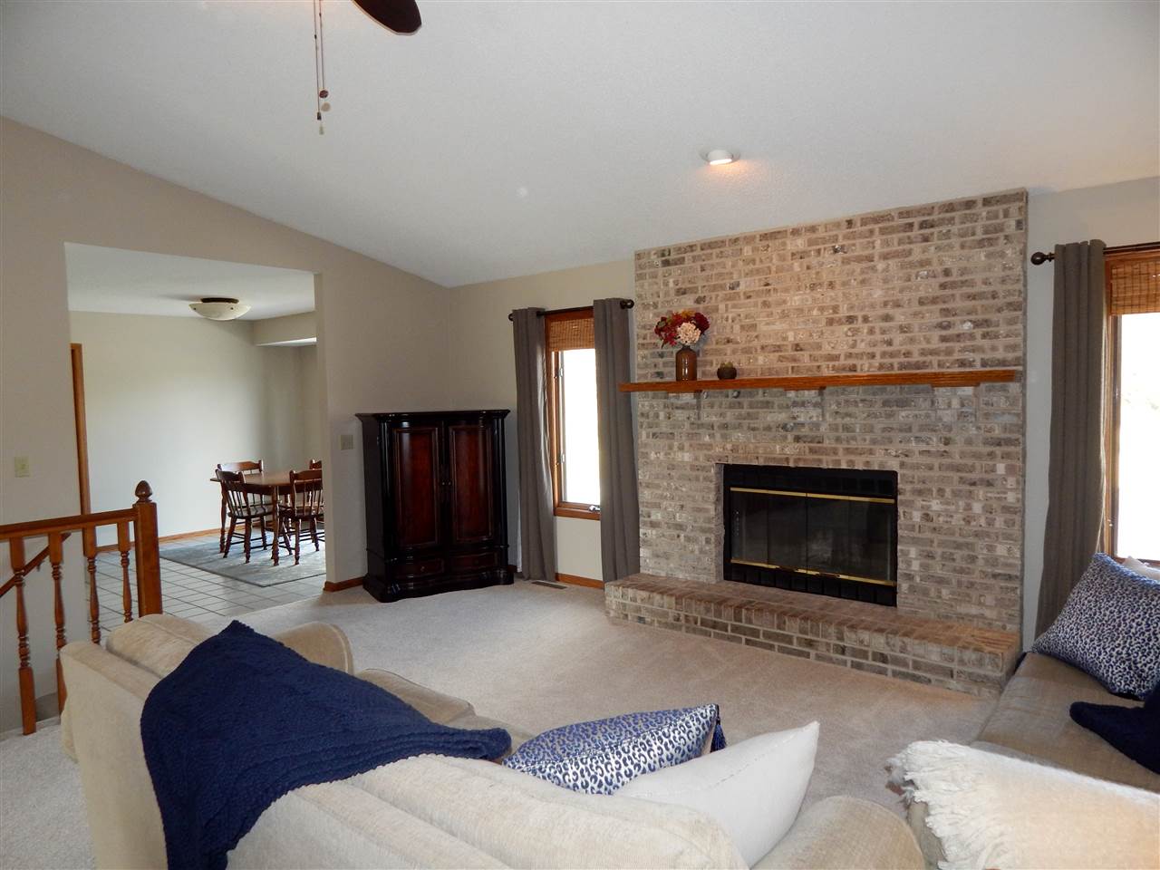 10001 Atwood Road Roscoe, IL 61073 - Photo 8 of 24 a living room with furniture and a fireplace