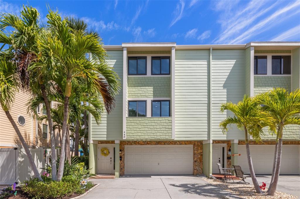 440 Sandy Hook Road Treasure Island, FL 33706 - Photo 1 of 1 a potted plant sitting in front of a house