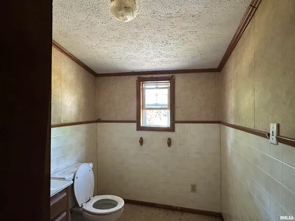 a bathroom with a toilet and a sink