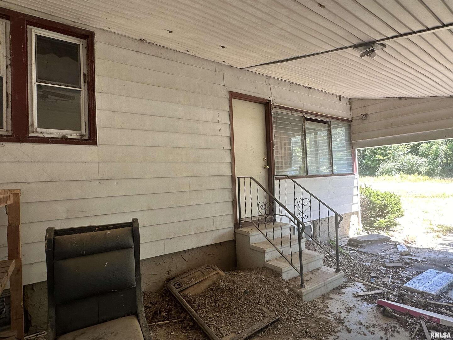 5672 Old Rte 13 Carterville, IL 62918 - Photo 20 of 29 a porch with seating space and a yard