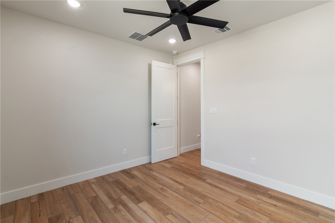 7822 Mathis Crk Drive Bryan, TX 77808 - Photo 29 of 43 wooden floor in an empty room