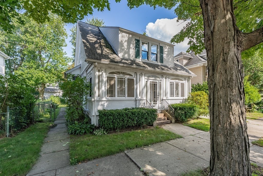 73 Sunapee Street Springfield, MA 01108 - Photo 1 of 40 a front view of a house with a yard and potted plants