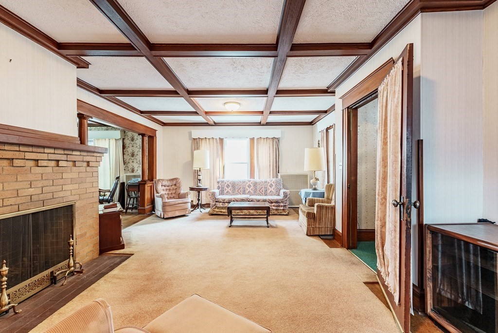73 Sunapee Street Springfield, MA 01108 - Photo 13 of 40 a living room with furniture and a fireplace