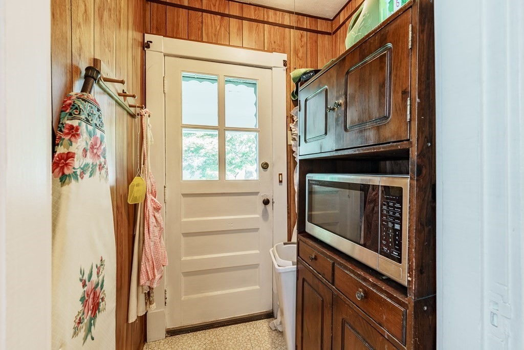 73 Sunapee Street Springfield, MA 01108 - Photo 16 of 40 a kitchen with a refrigerator and a stove