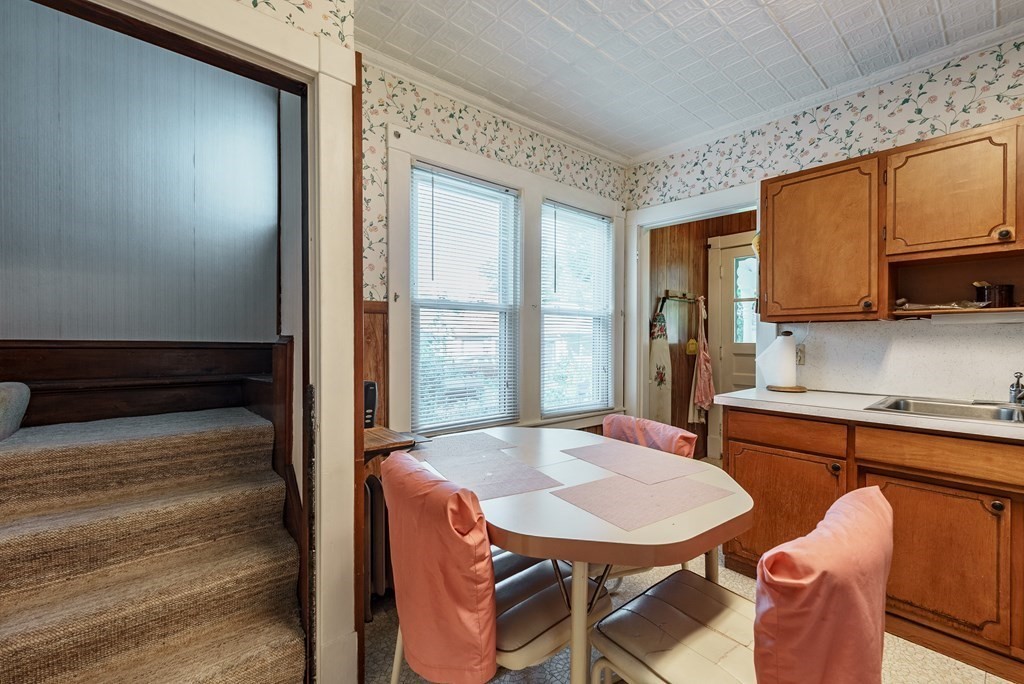 73 Sunapee Street Springfield, MA 01108 - Photo 19 of 40 a dining room with furniture and a window