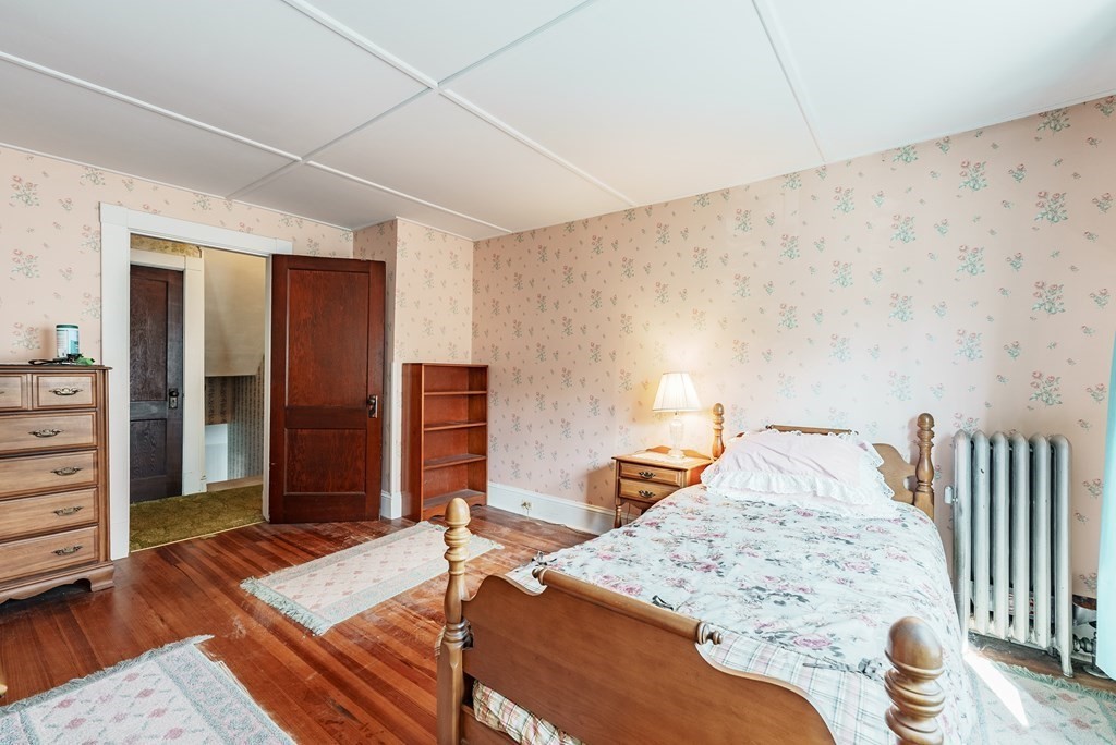 73 Sunapee Street Springfield, MA 01108 - Photo 25 of 40 a bedroom with a bed and a dresser