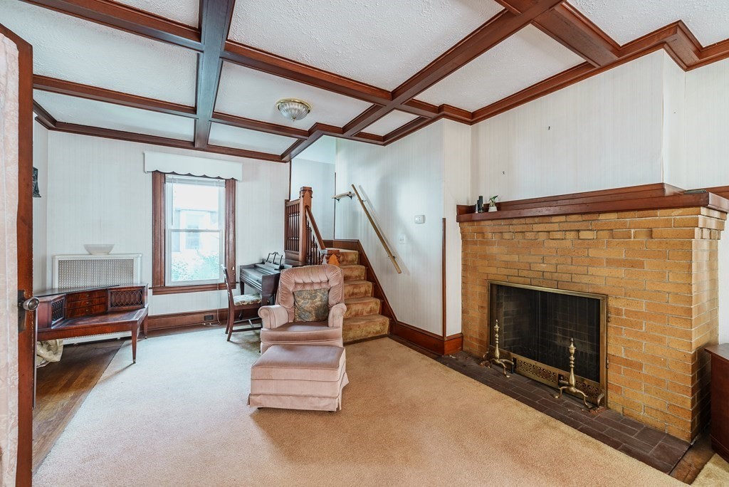 73 Sunapee Street Springfield, MA 01108 - Photo 6 of 40 a living room with furniture and a fireplace