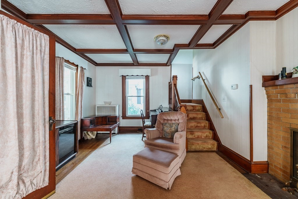 73 Sunapee Street Springfield, MA 01108 - Photo 7 of 40 a living room with furniture and a fireplace