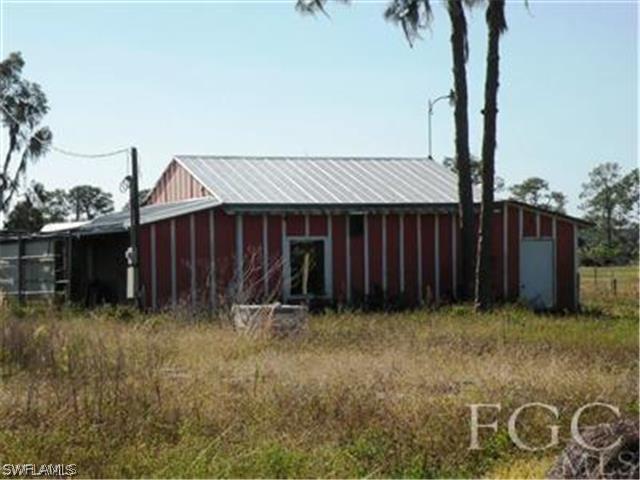 2350 Wendy Road LaBelle, FL 33935 - Photo 2 of 7 a front view of a house having yard