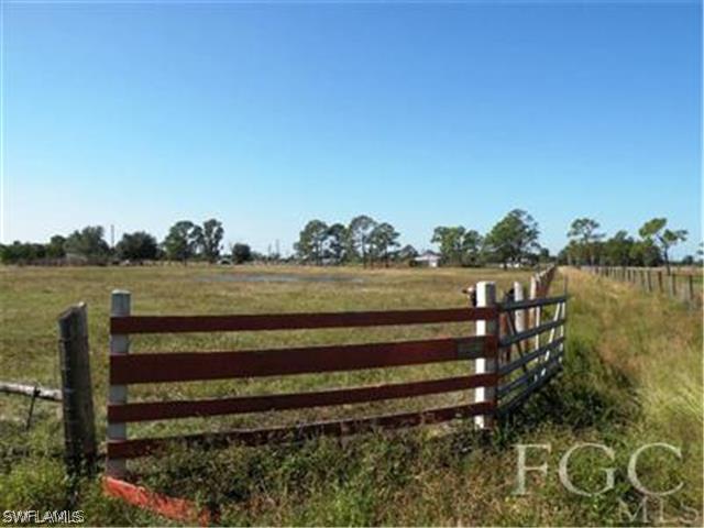 2350 Wendy Road LaBelle, FL 33935 - Photo 7 of 7 a view of a green field with wooden fence