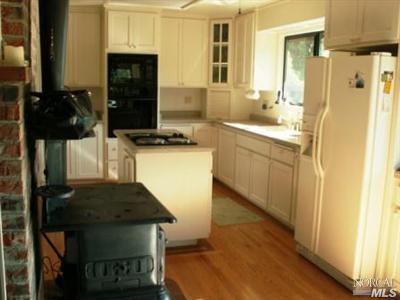 2316 Mark West Springs Road Santa Rosa, CA 95404 - Photo 10 of 12 a kitchen with a sink appliances and cabinets