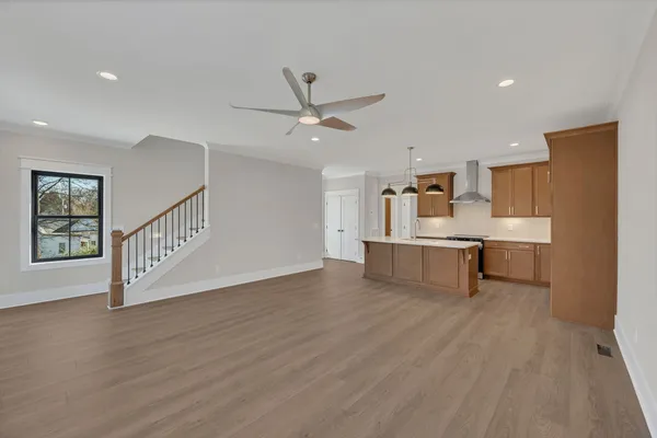 a view of kitchen with furniture and wooden floor