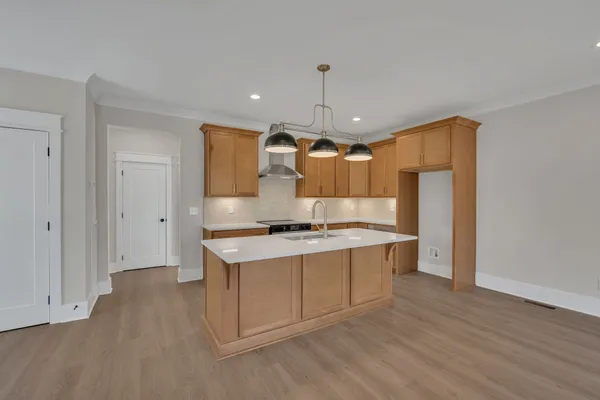 a kitchen with stainless steel appliances granite countertop a stove and a refrigerator