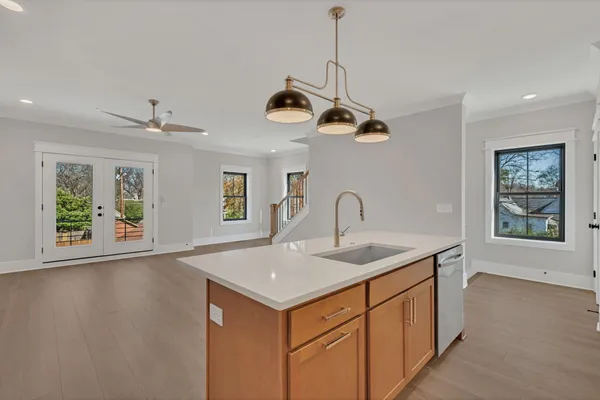 a kitchen with a sink a counter top space and appliances