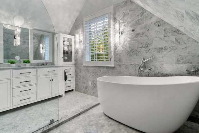 a bathroom with a bathtub and a sink