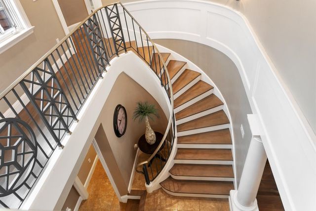a view of a balcony with furniture and chandelier