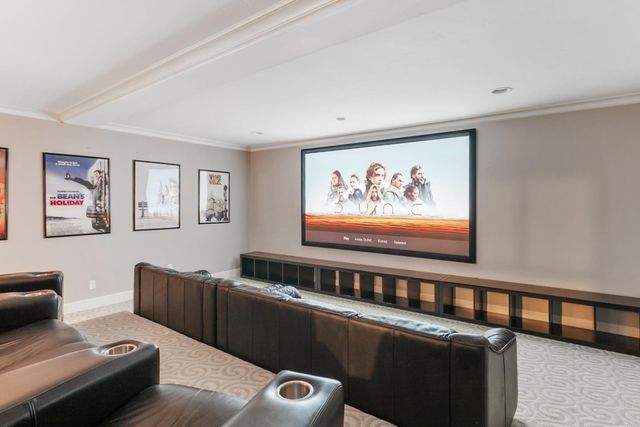 a view of a white house with couches in front of it