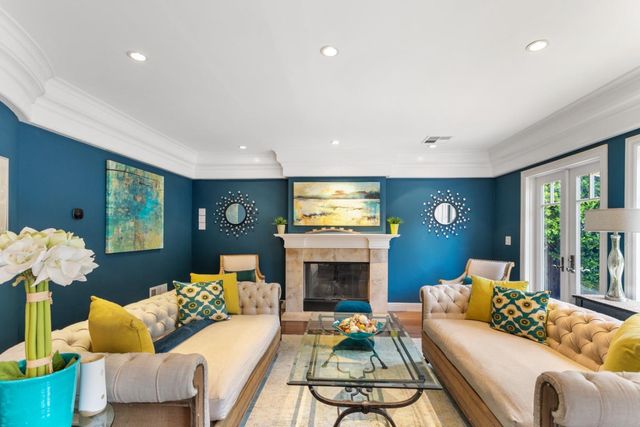 a living room with furniture fireplace and a flat screen tv