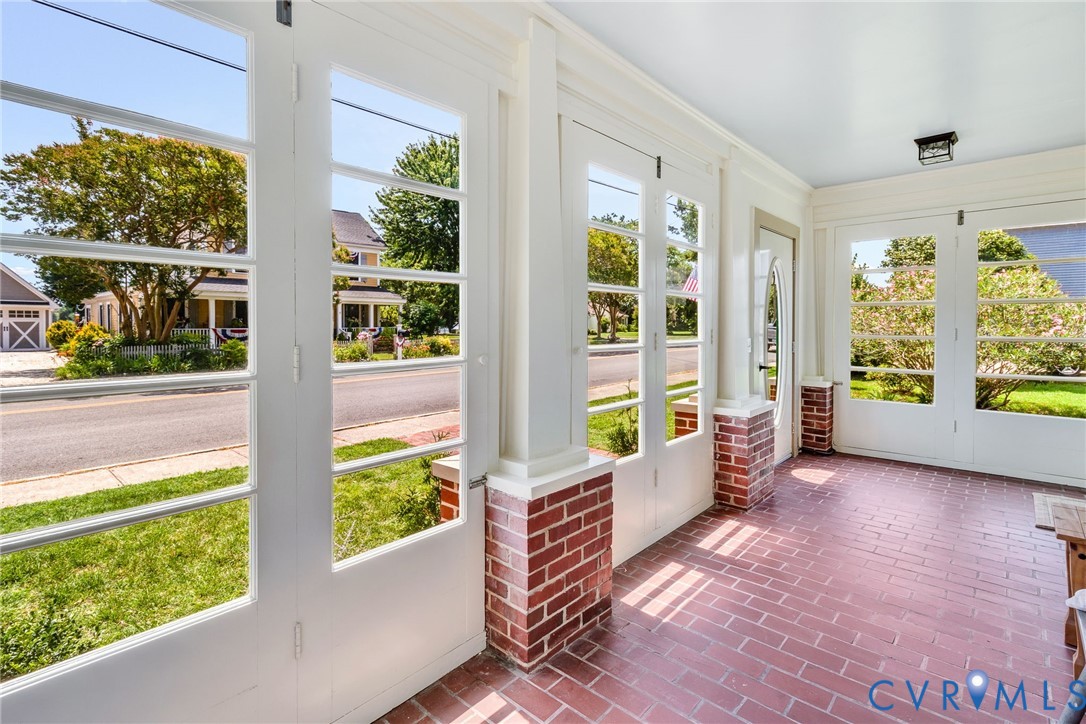 618 Main Street Reedville, VA 22539 - Photo 4 of 54 Sun-drenched enclosed porch featuring brick floori